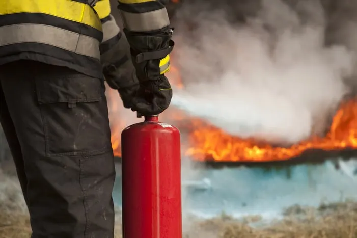 Firefighter with extinguisher during a fire watch